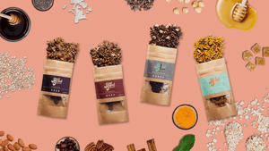 A flat lay of Just So Good granola’s four delicious and nutritious granola packs, with granola spilling out of the bags and surrounded by spices, nuts, seeds, honey, ginger and oats creating a fun bright impactful image .